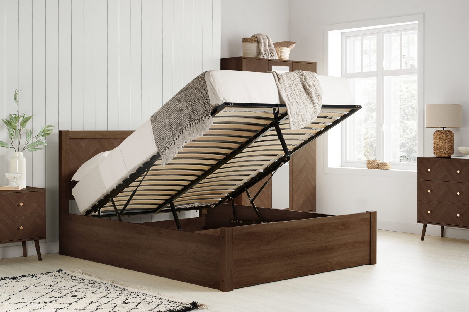 Ottoman bed with the base lifted to show the storage space underneath